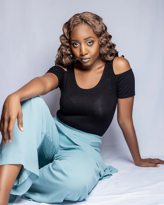 a woman in a black shirt and blue pants