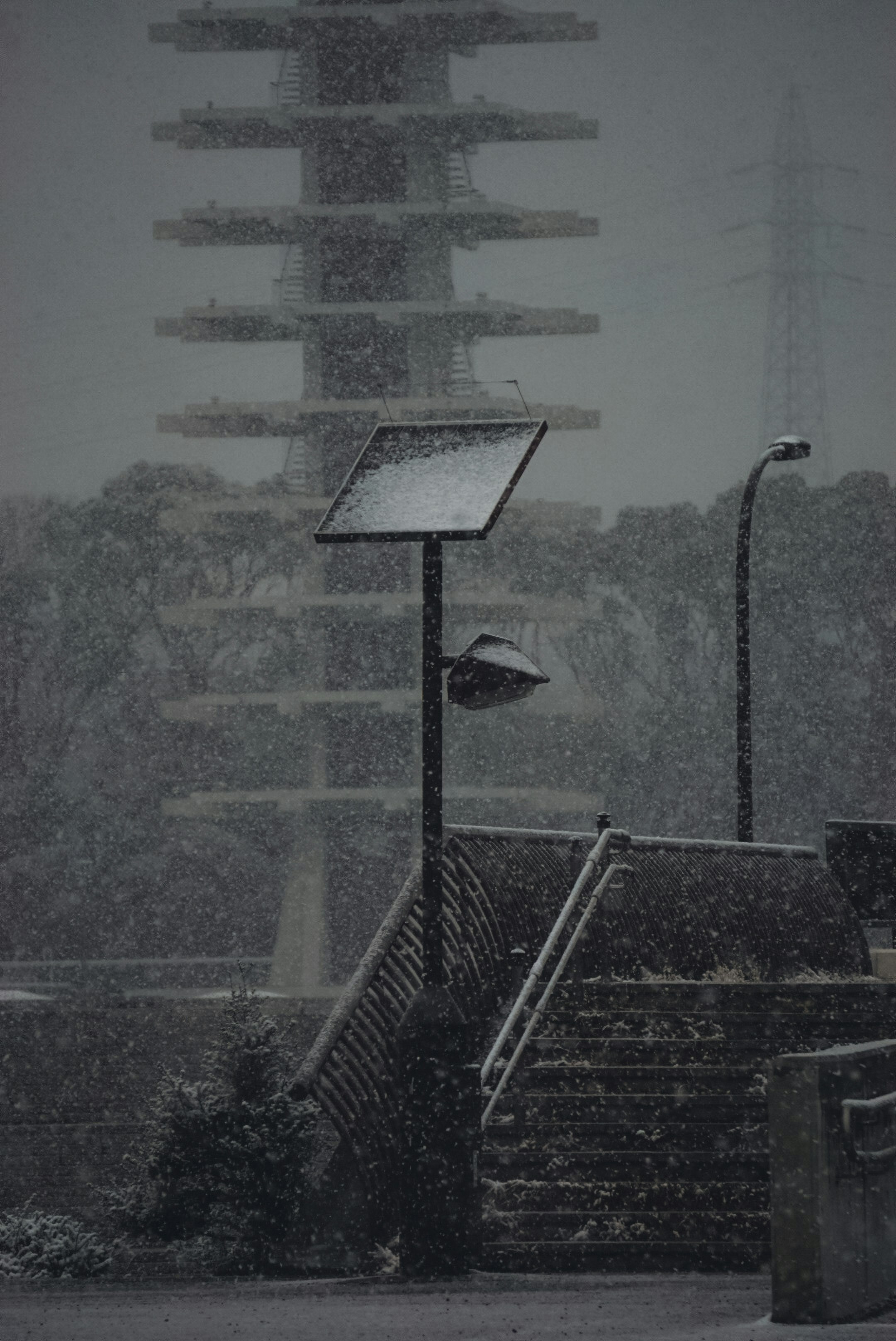 a street light sitting next to a set of stairs