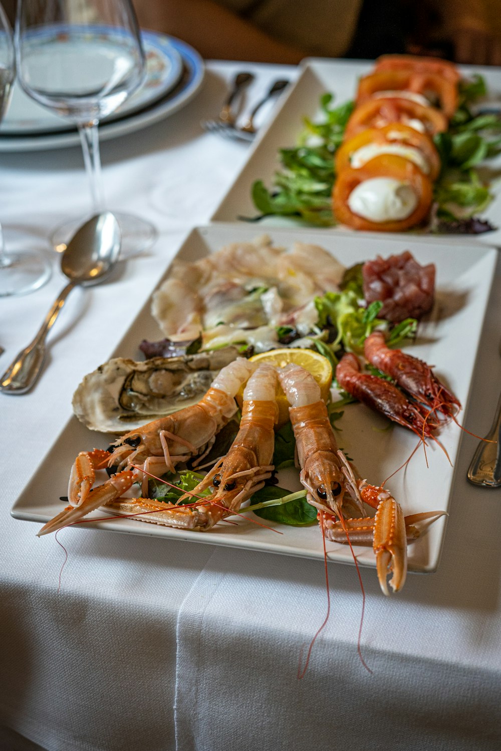 a plate of food on a table with utensils