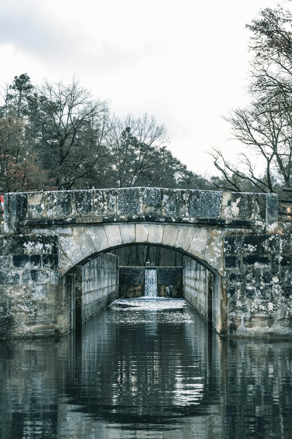 a stone bridge over a body of water