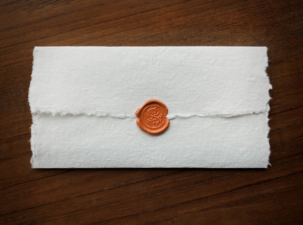 a wax stamp on a piece of paper
