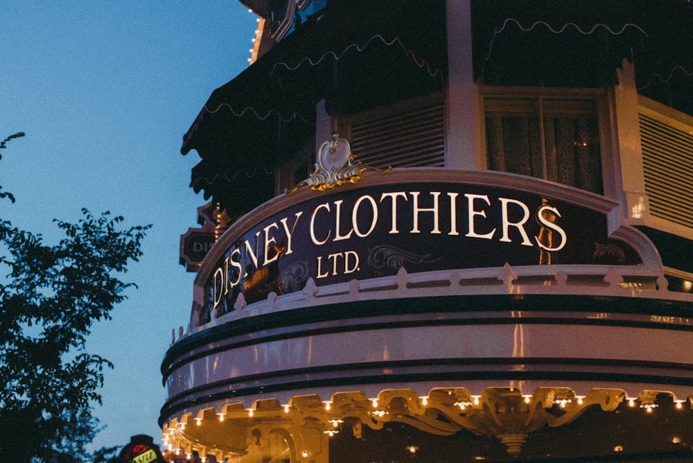 a building with a sign that says disney clothes ltd