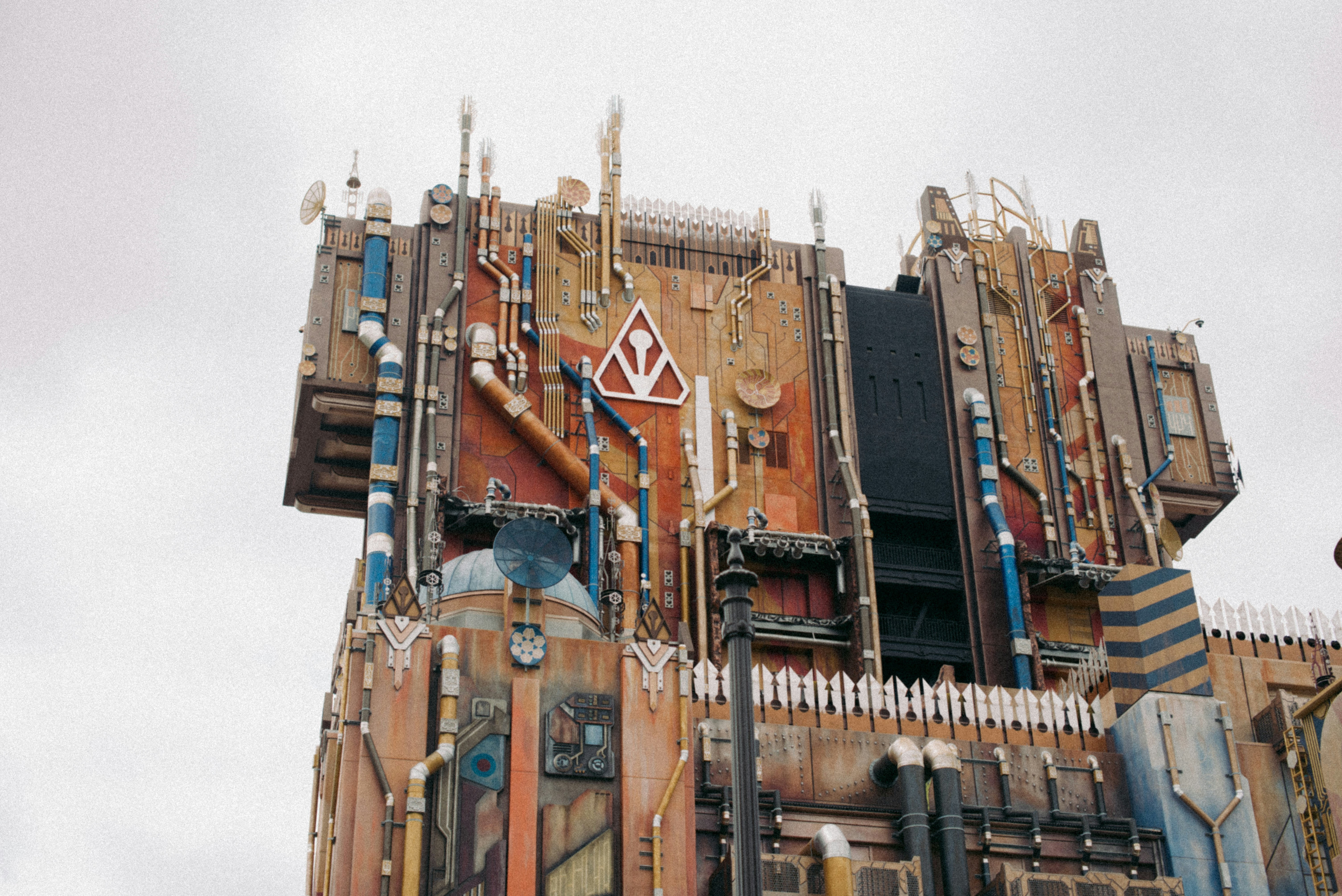 a very tall building with a clock on it's side