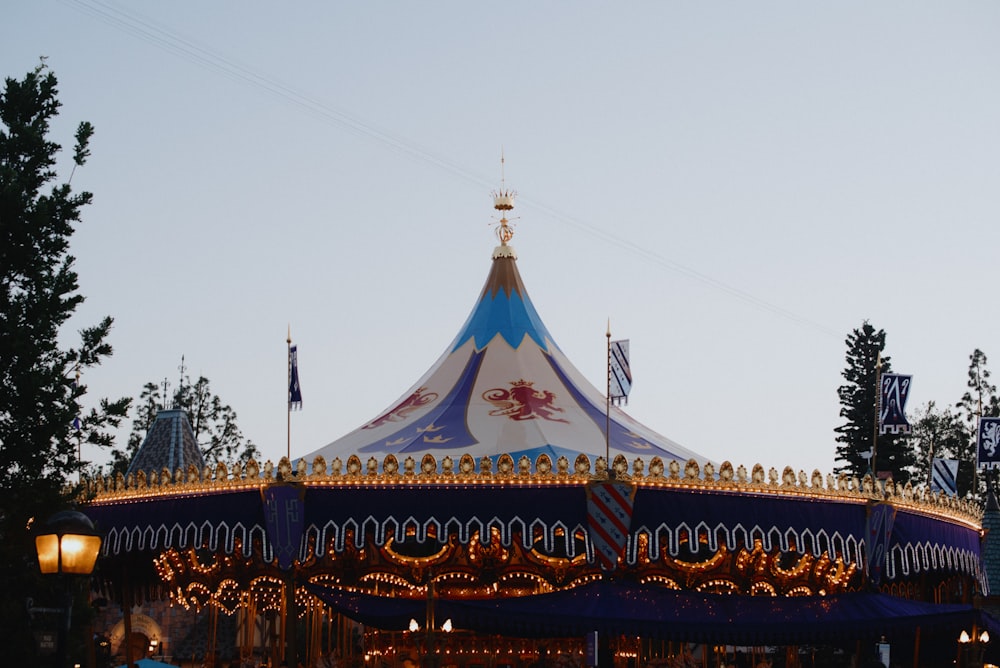 a merry go round in a park at dusk