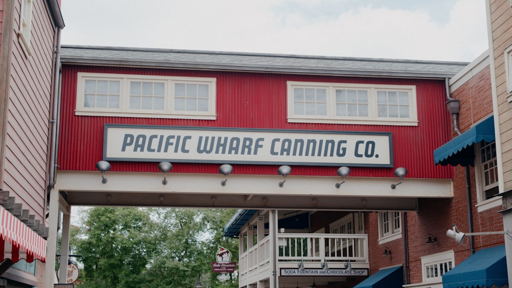 a red building with a sign that says pacific wharf gaming co