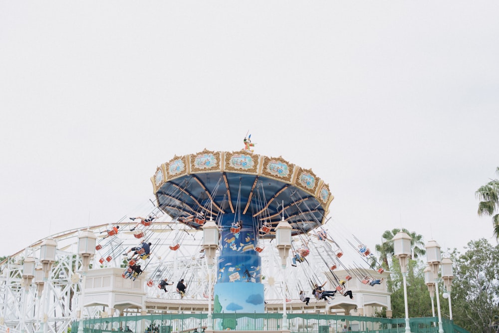 a carnival ride with people riding on it