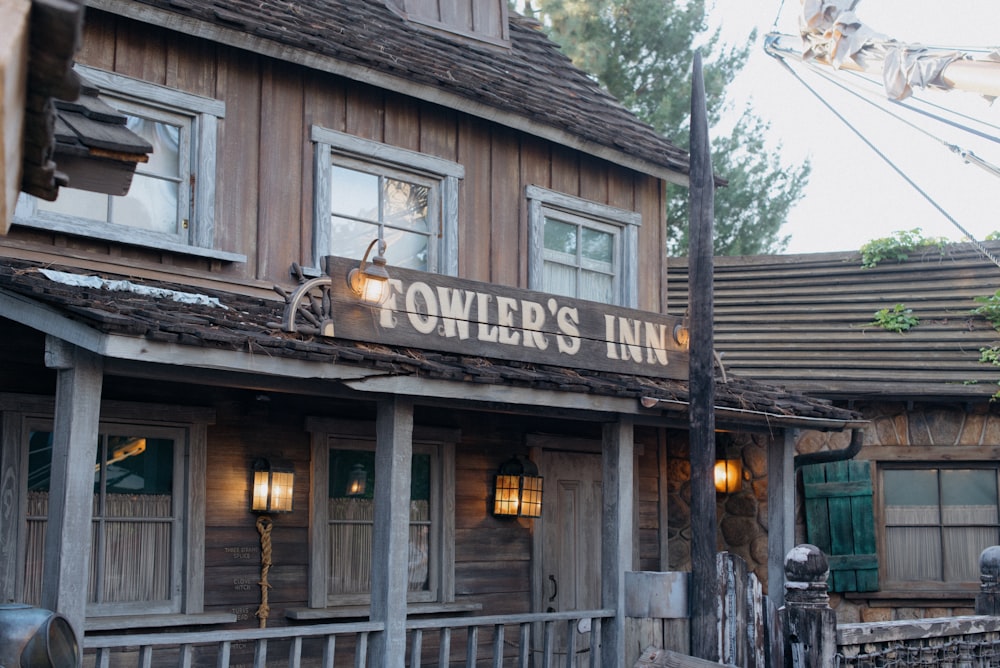 a wooden building with a sign that says tower's inn