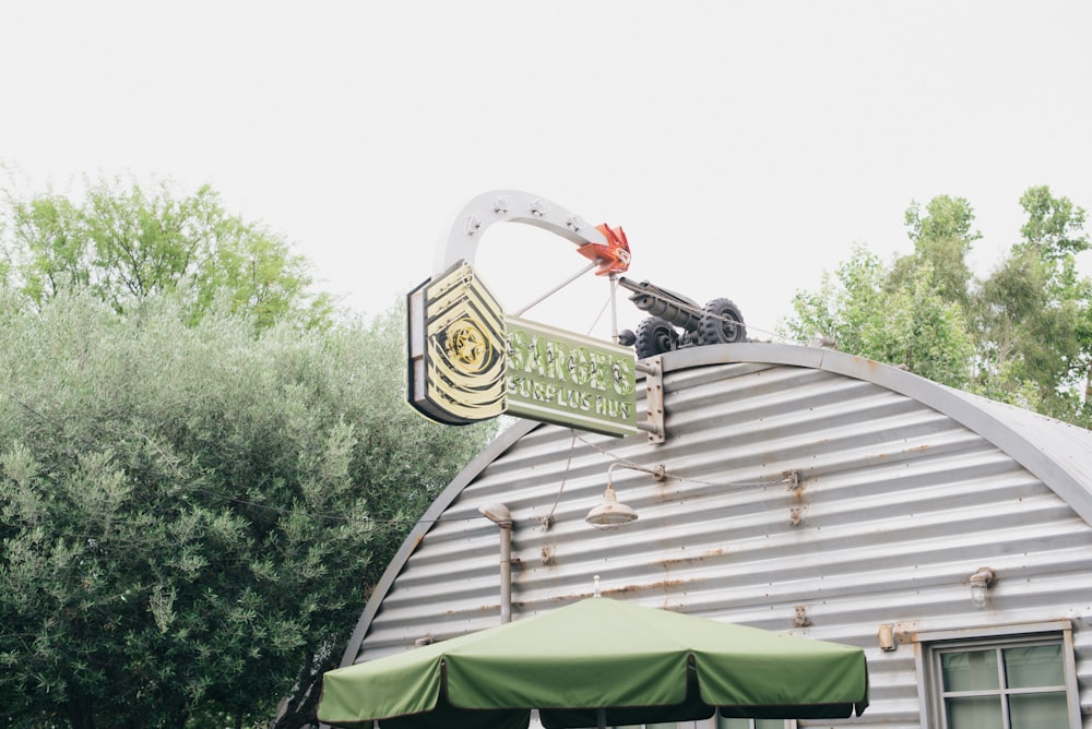 a large metal building with a sign on top of it