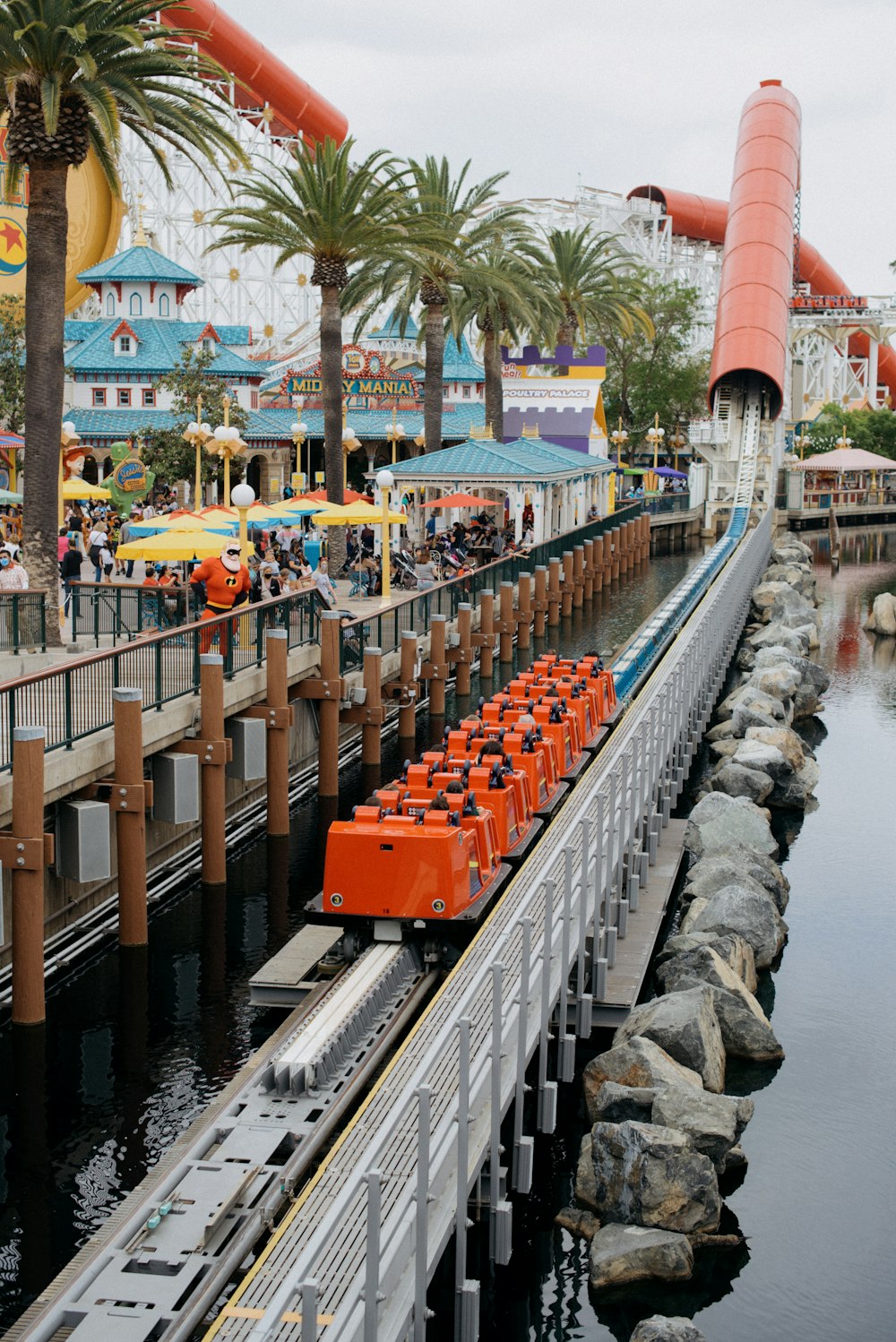 an amusement park with a train on the tracks