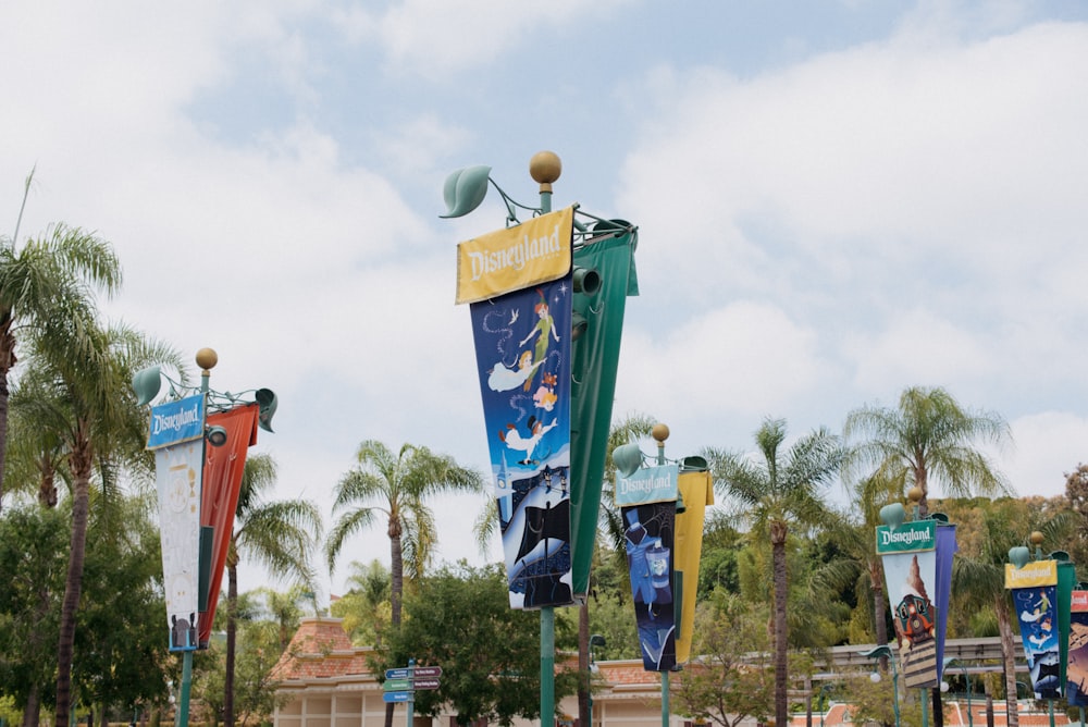 a bunch of flags that are on a pole