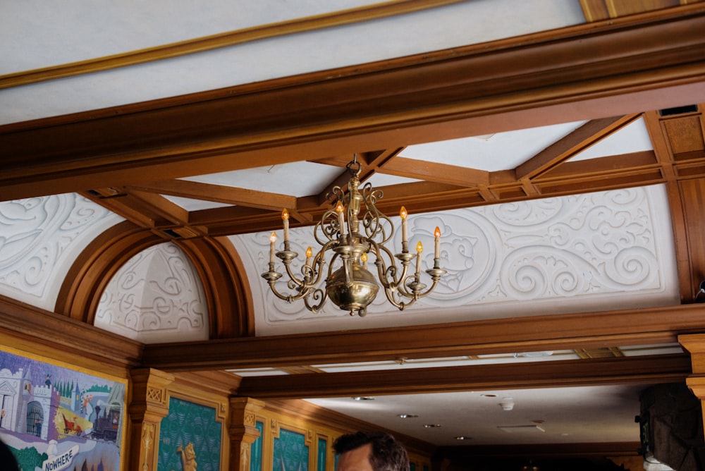 a chandelier hanging from the ceiling of a restaurant