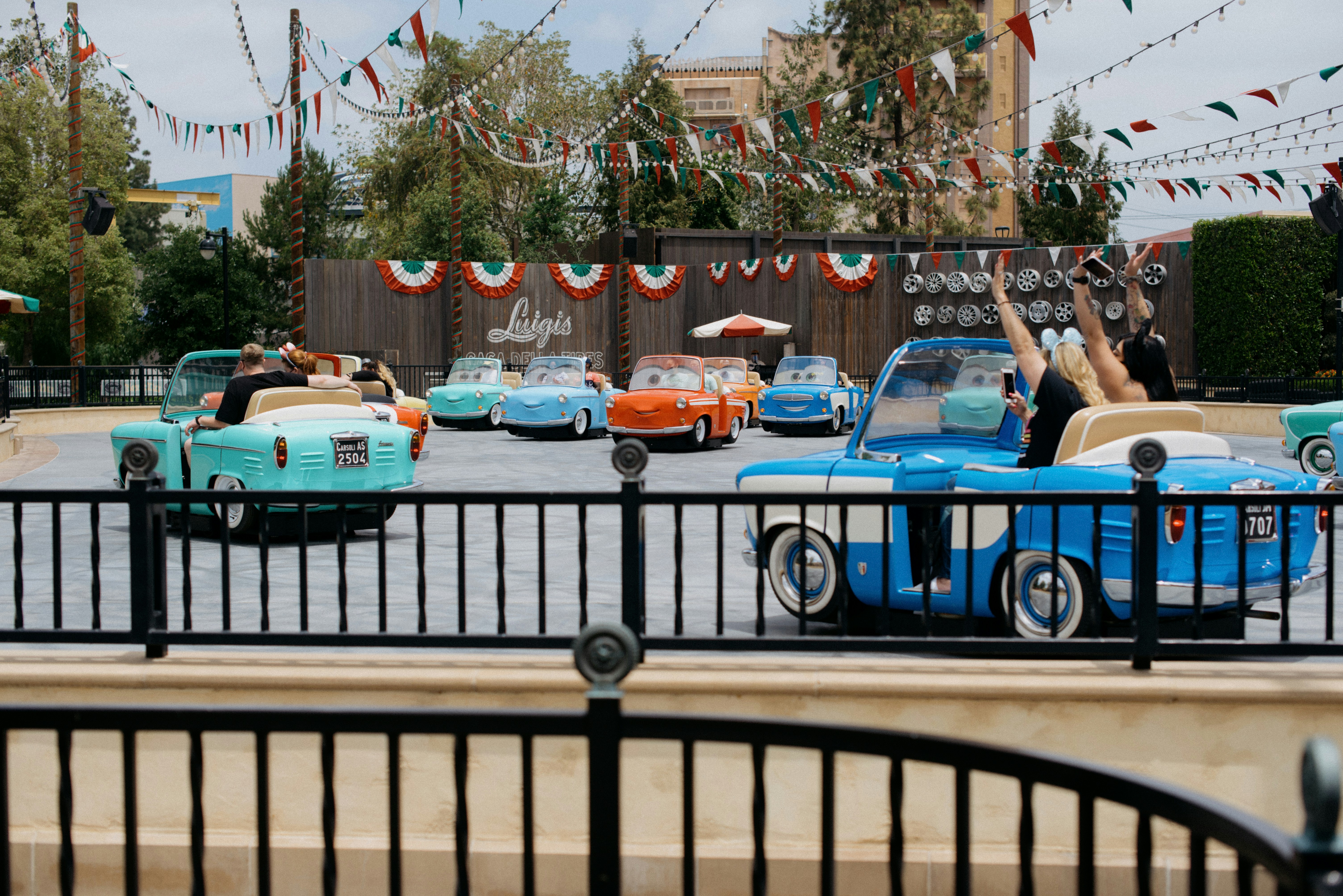 a group of cars parked next to each other in a parking lot