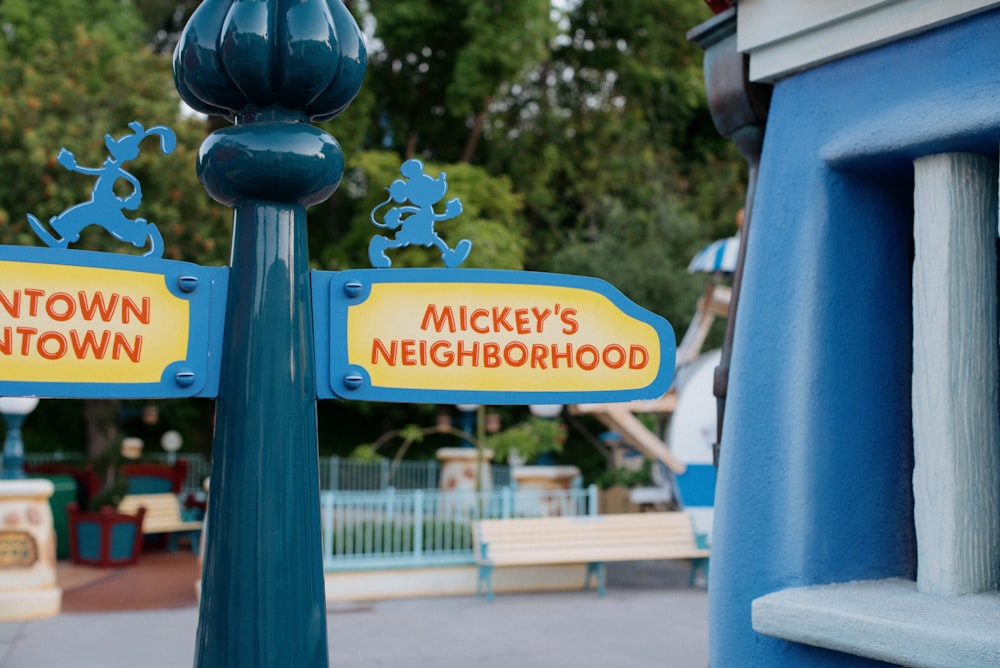 a street sign in front of a playground