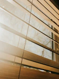 a close up of a closed window with blinds