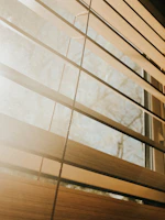 a close up of a closed window with blinds