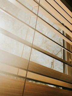 a close up of a closed window with blinds