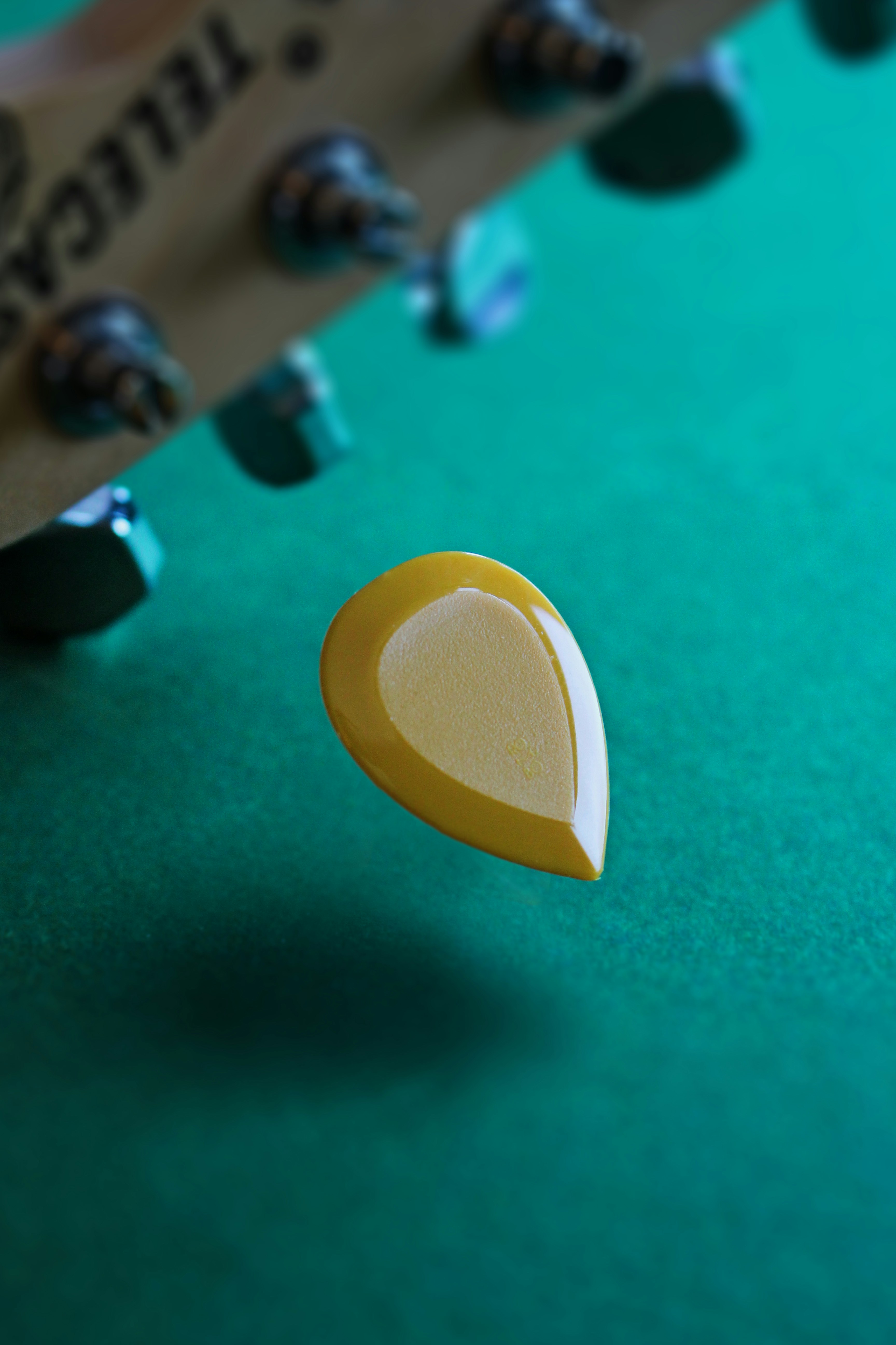 guitar pick and electric guitar