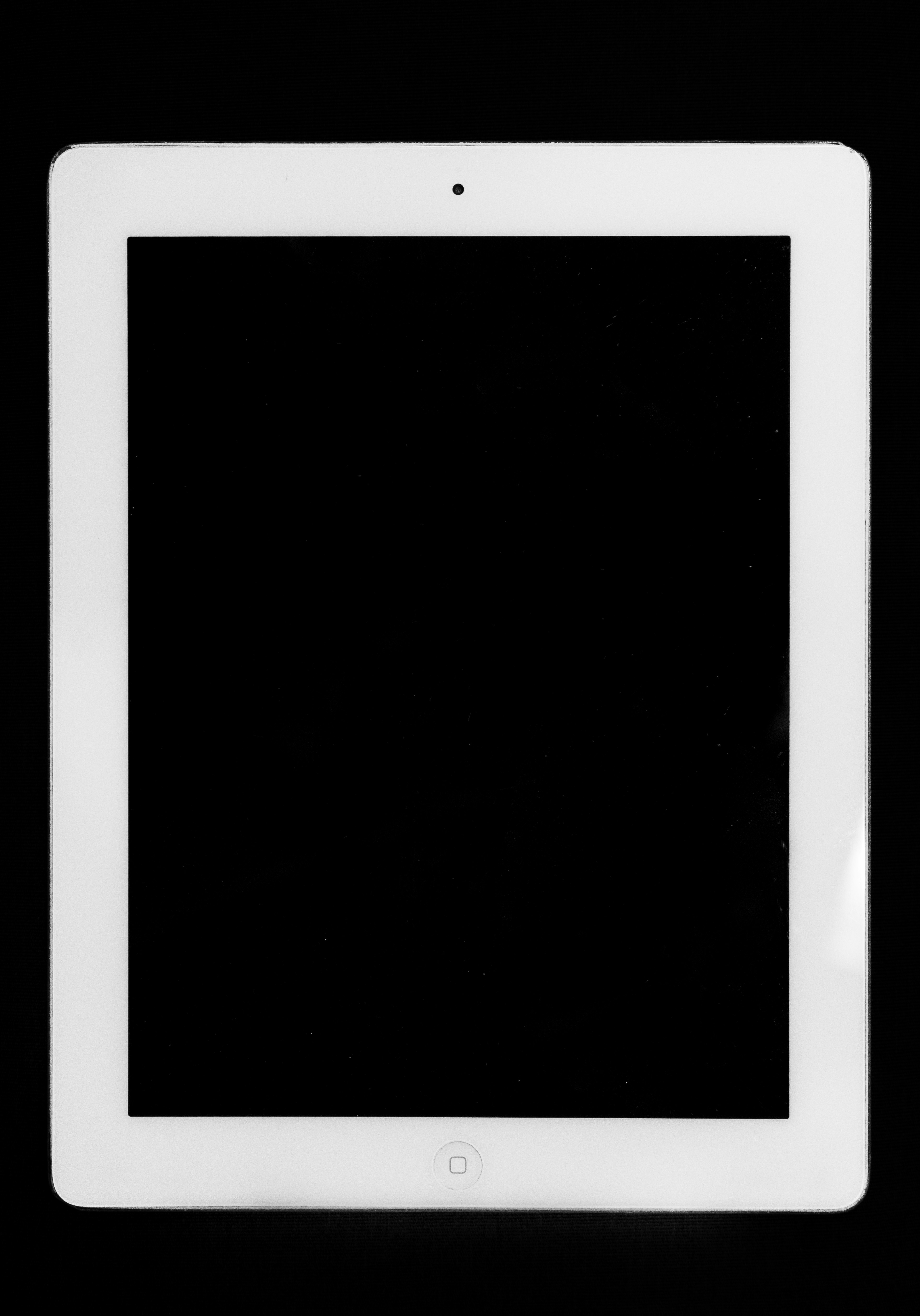 a white tablet computer sitting on top of a table