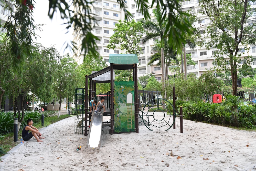 a children's play area with a slide and climbing frame