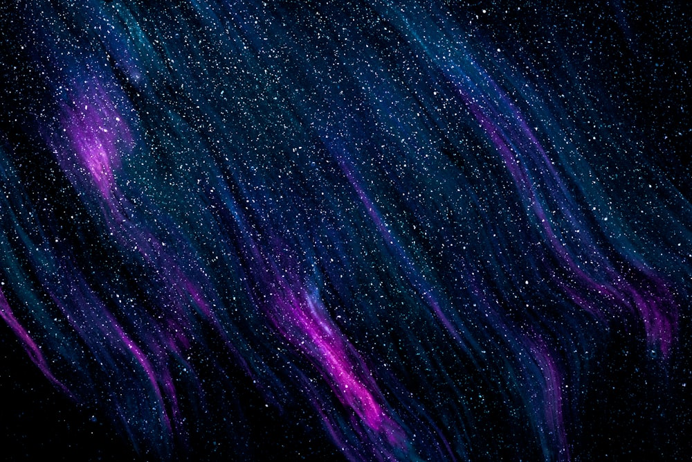 a purple and blue background with stars