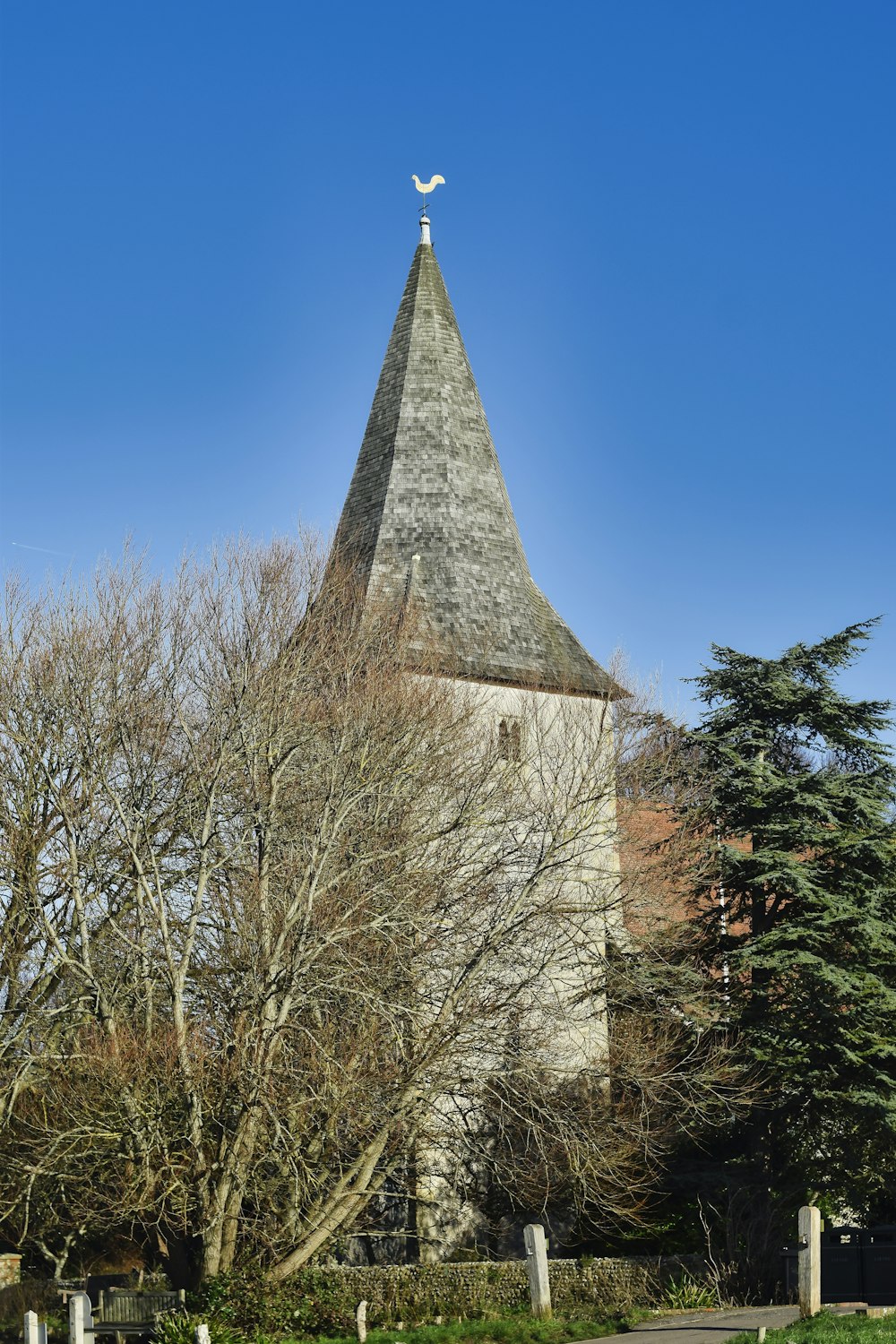 a church steeple with a cross on top of it