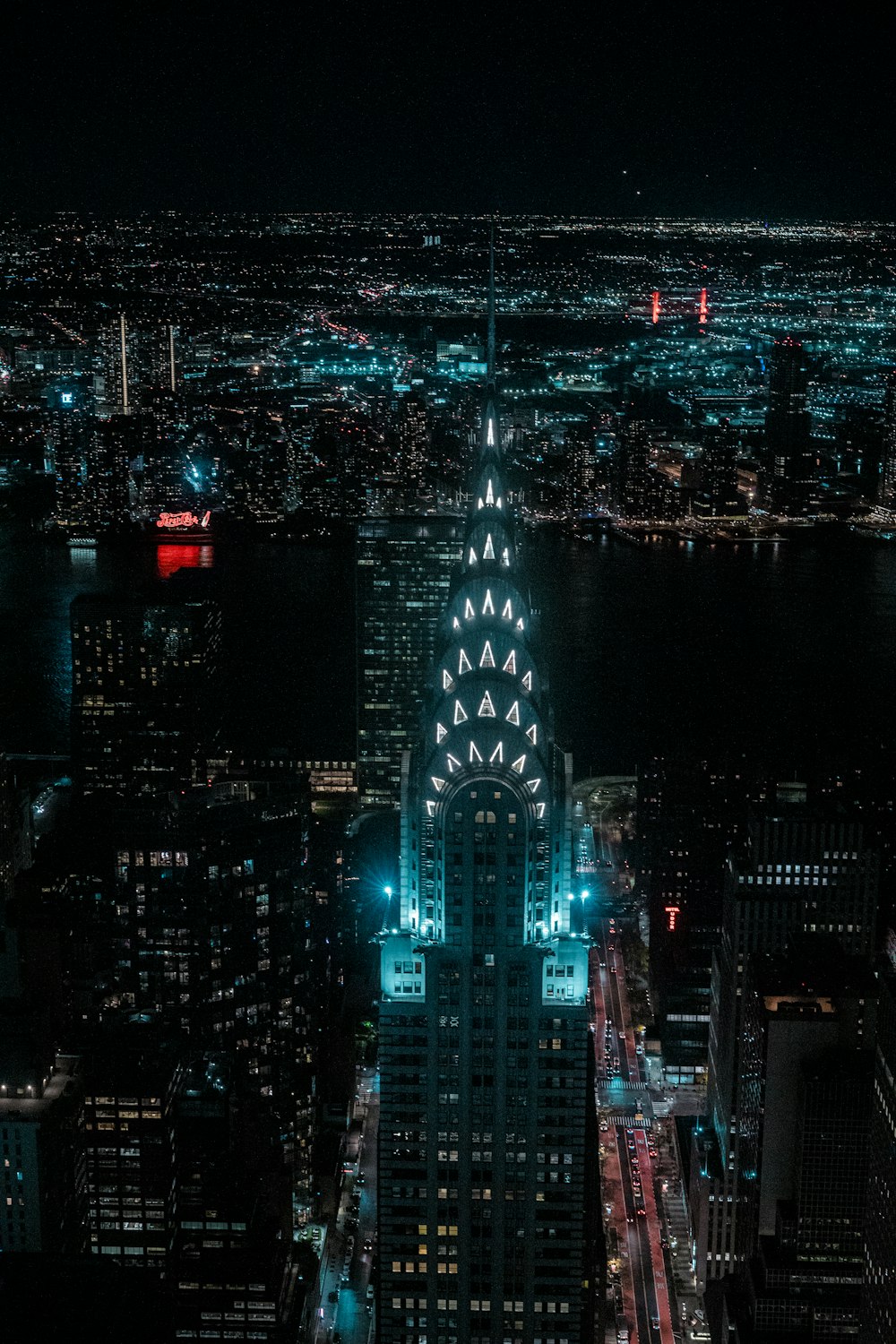 a view of a city at night from the top of a building