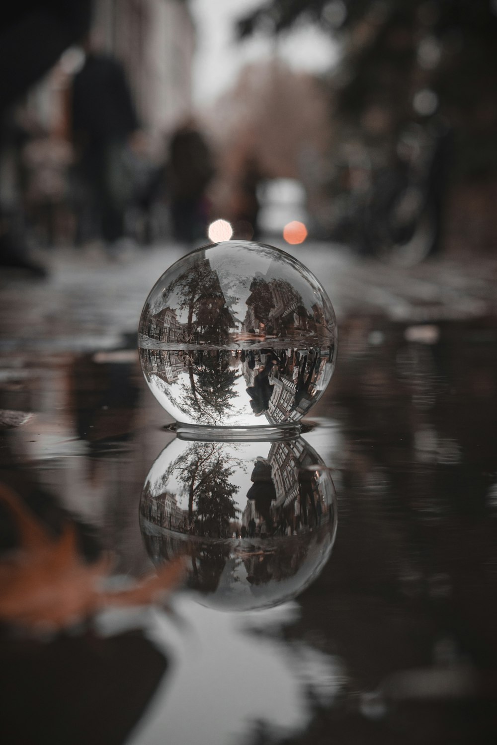 a glass ball sitting on top of a table