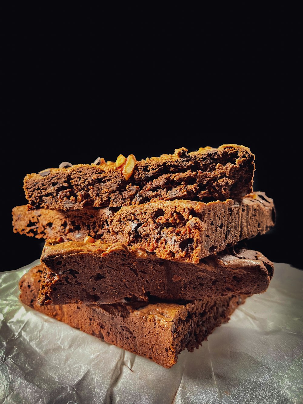 a pile of brownies sitting on top of a table