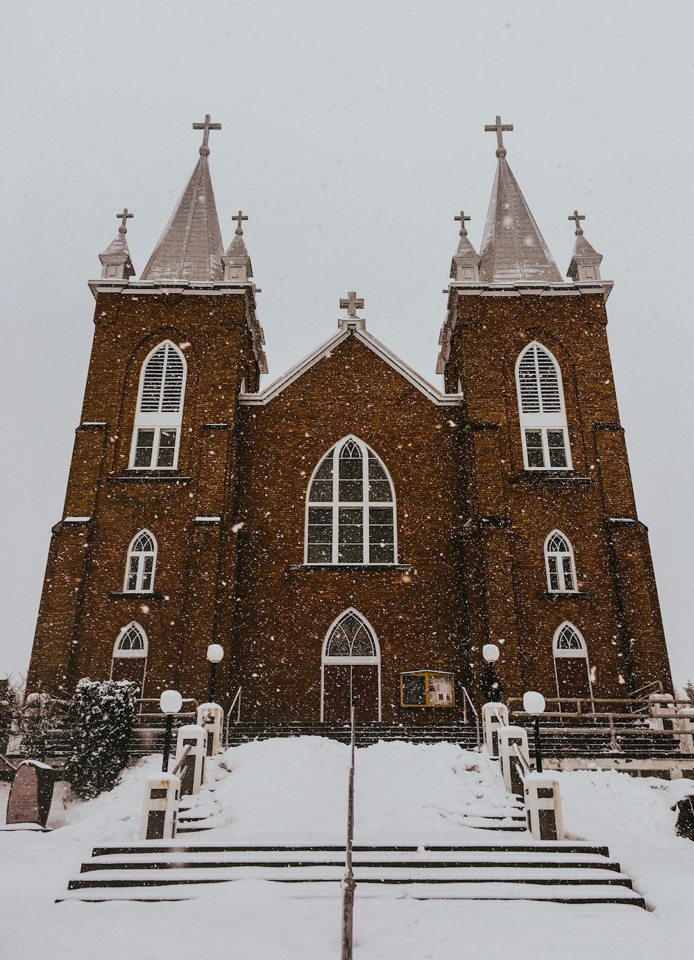 a church with a lot of snow on the ground