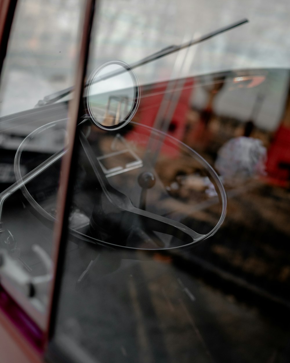 a close up of a car door with a reflection of a person