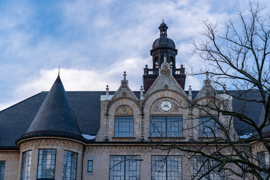 a large building with a clock on the top of it,