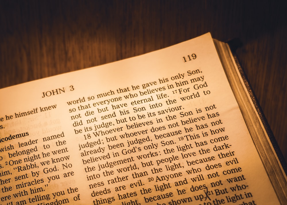 a book opened to a page of john 3