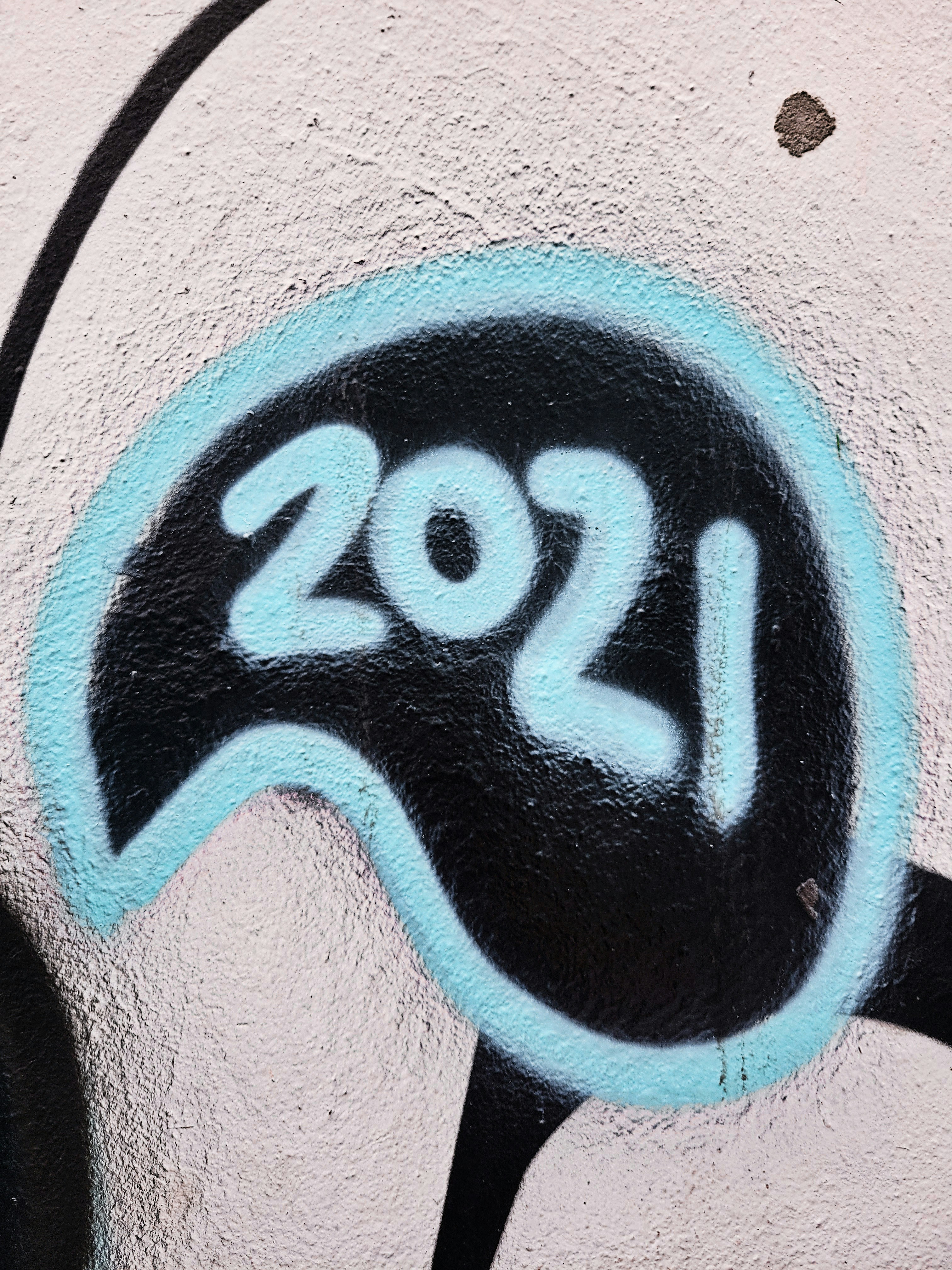 a close up of a wall with graffiti on it