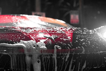 Race car getting cleaned with cleaning products NASA Member Benefits Motorsports Gear