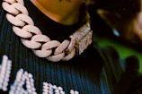 Close-up of a delicate 18k Italian gold chain resting on black velvet.