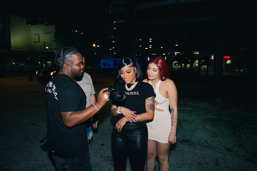 Teyana Taylor and woman posing for a picture