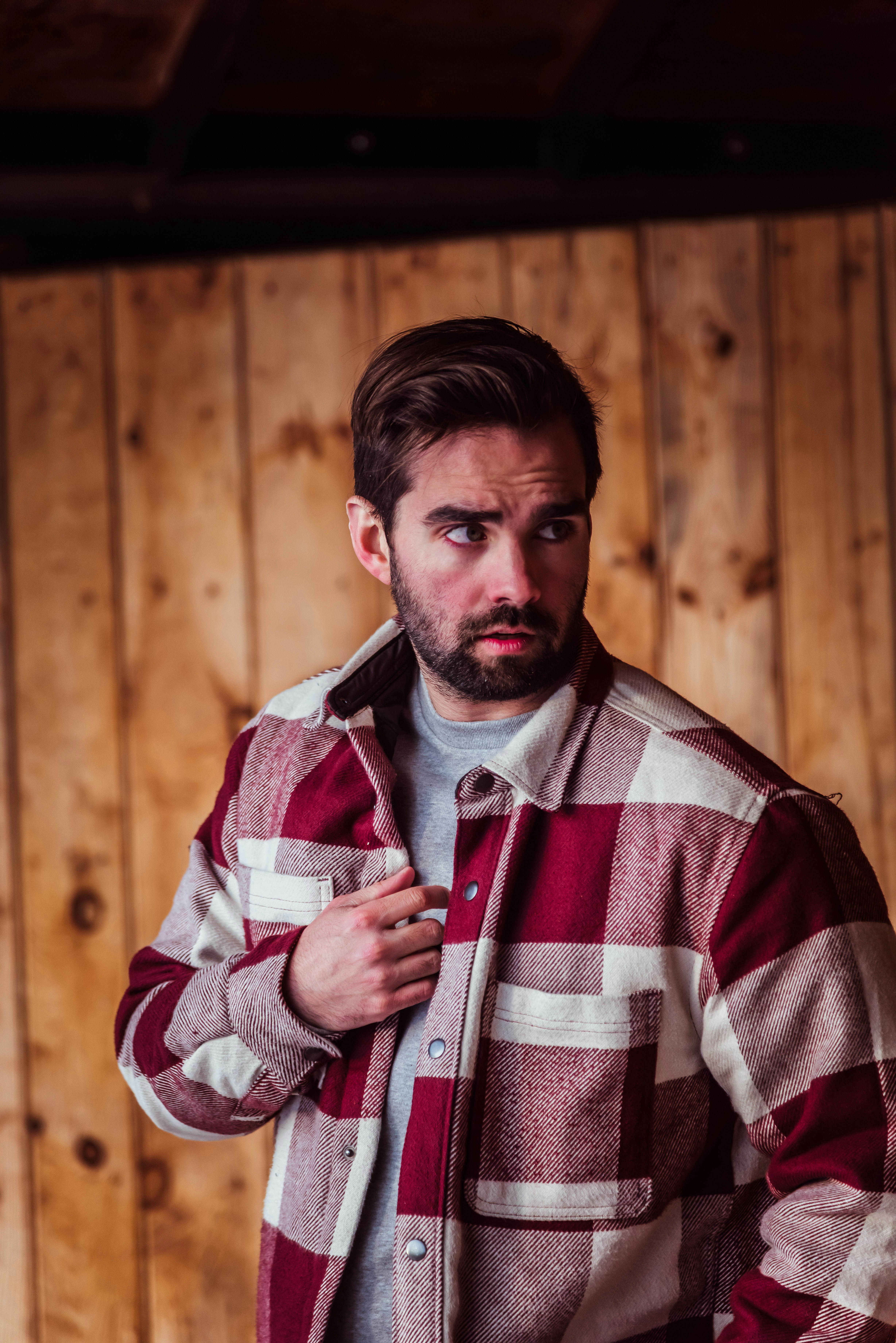 a man in a red and white checkered jacket