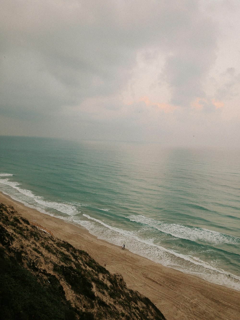 a view of the ocean from a hill