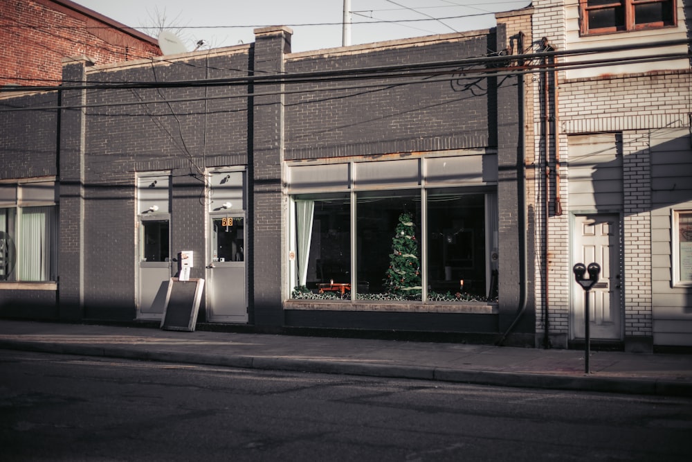 a large brick building with a store on the corner of a street