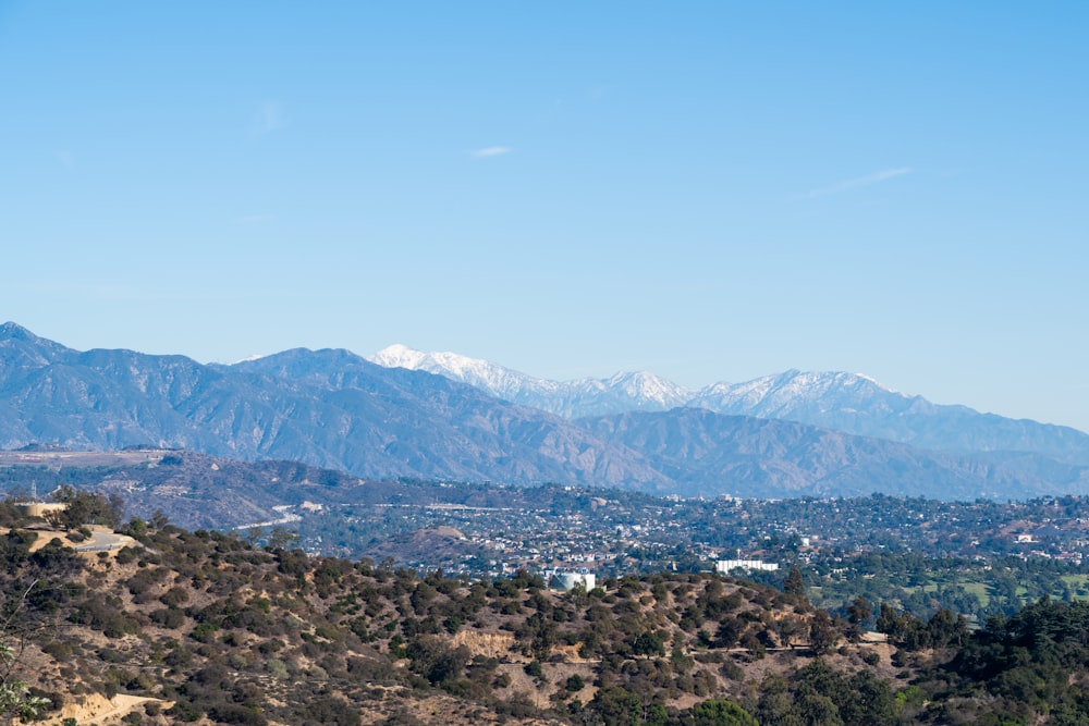 a view of a mountain range with a town in the distance