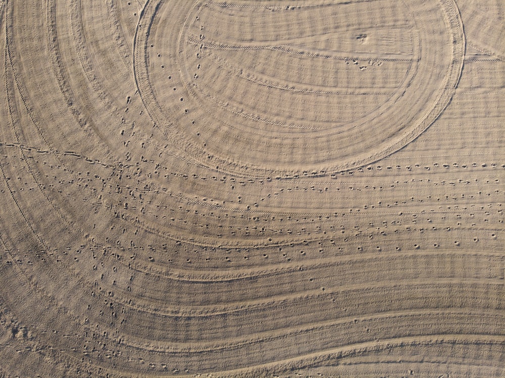 an aerial view of a circular pattern in the sand