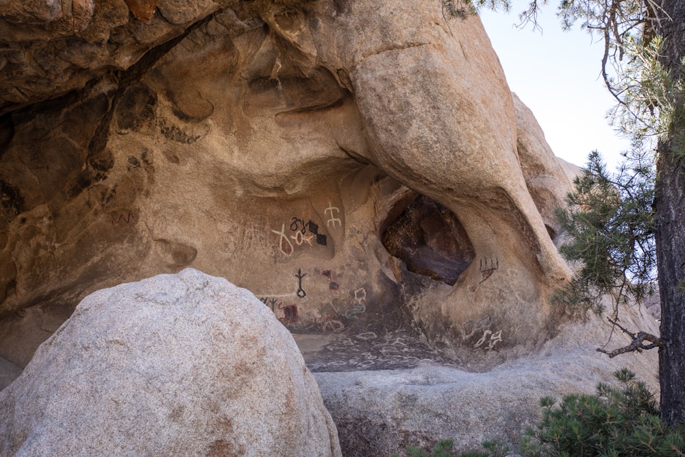 a rock formation with a cave in the middle of it