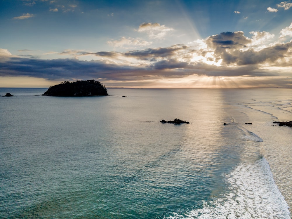 a body of water with a small island in the distance