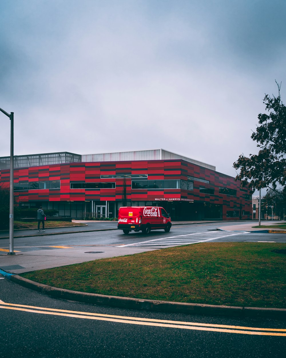 a large red building sitting on the side of a road