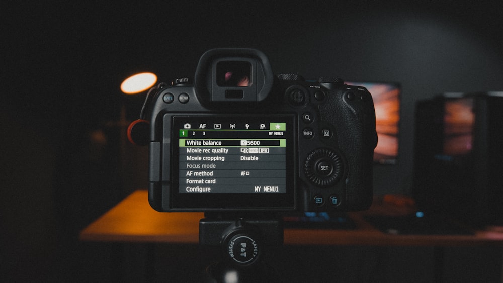 a camera with a screen showing the settings