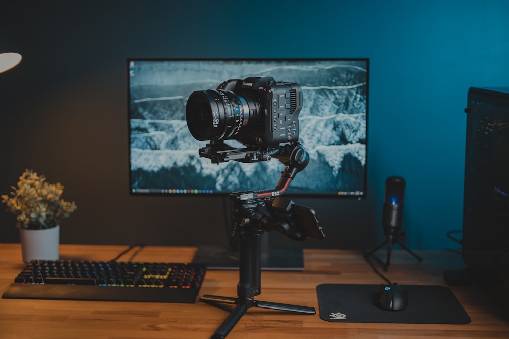 a camera sitting on top of a wooden desk