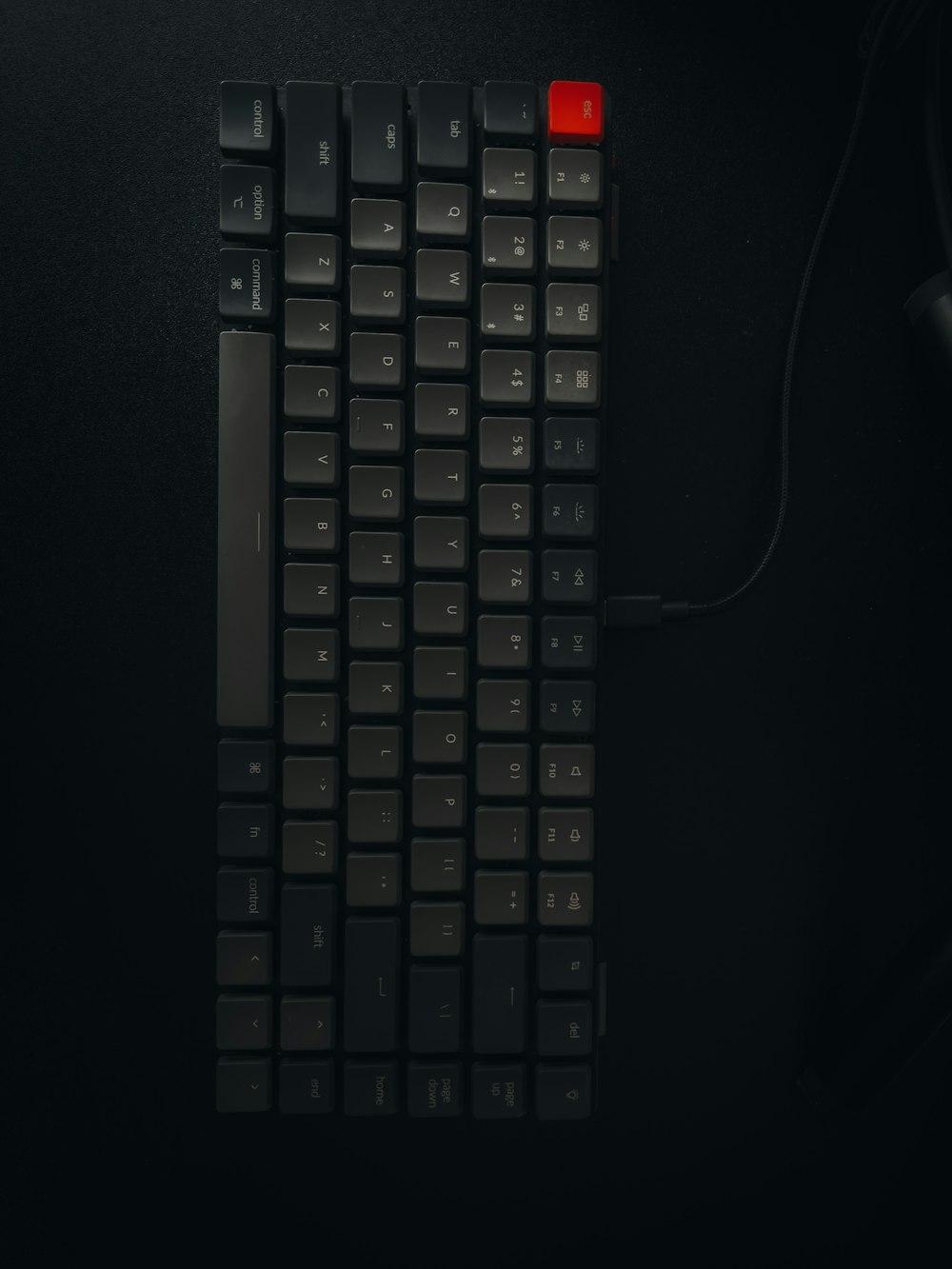 a black keyboard with a red light on it