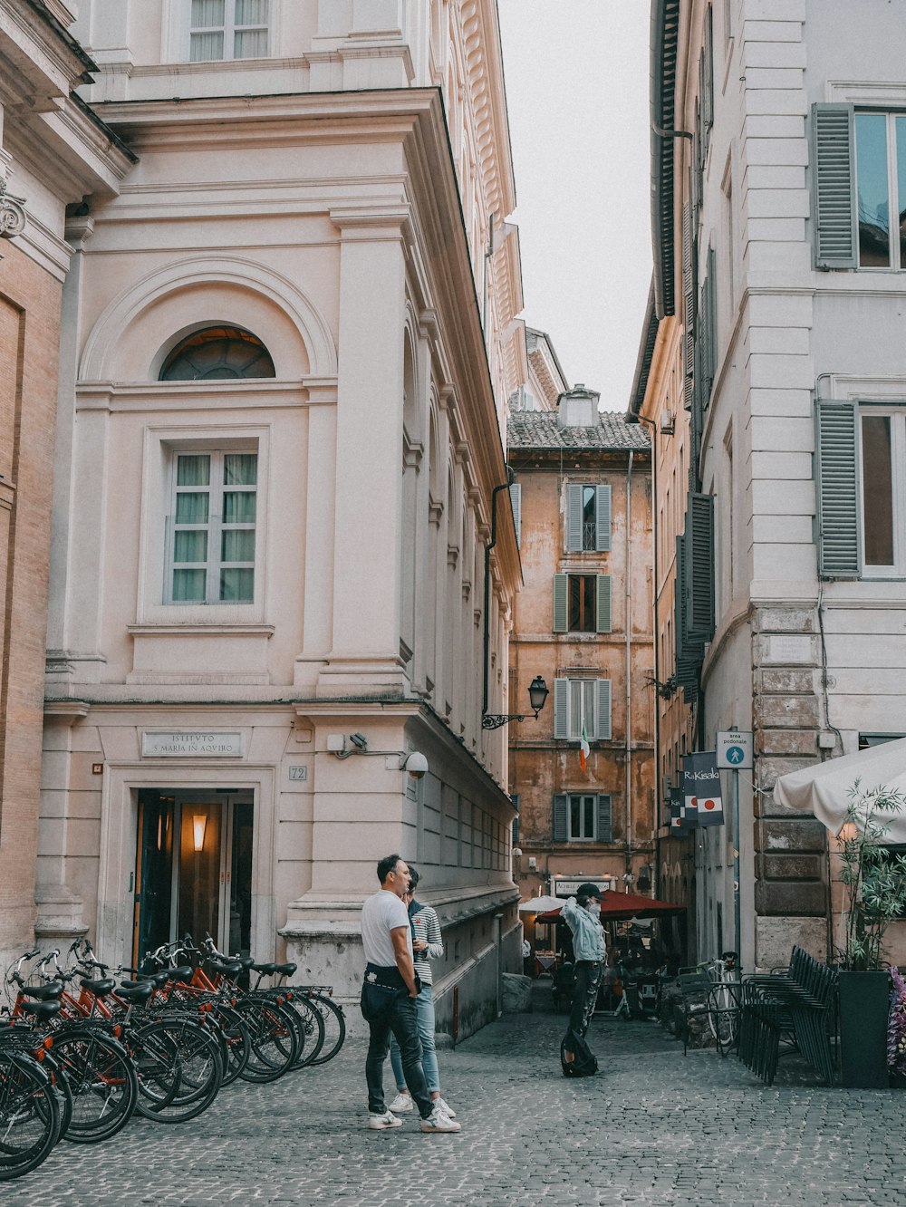 a couple of people that are standing in the street