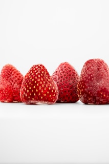a group of strawberries sitting next to each other