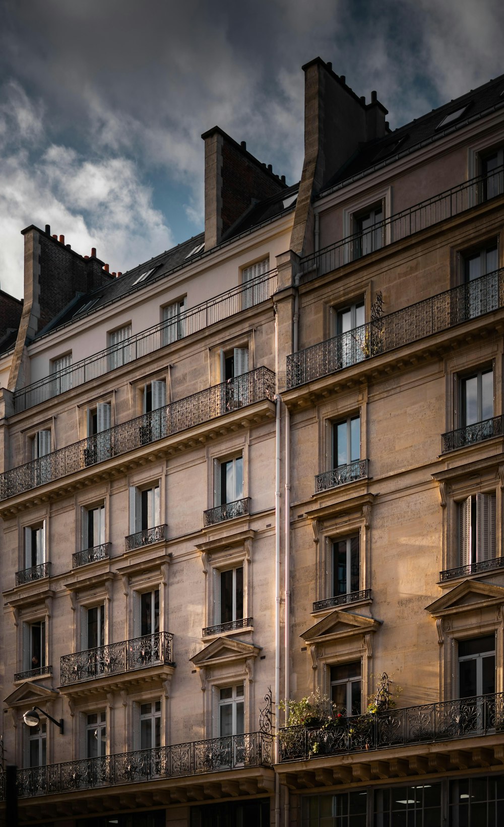 a tall building with balconies and balconies on the top of it